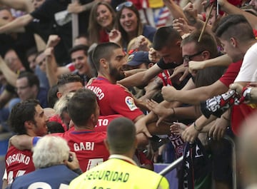 Carrasco celebrates his opener with Atleti fans