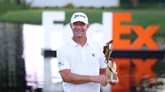 MEMPHIS, TENNESSEE - AUGUST 13: Lucas Glover of the United States poses with the trophy after putting in to win during the first playoff hole on the 18th green to win the tournament during the final round of the FedEx St. Jude Championship at TPC Southwind on August 13, 2023 in Memphis, Tennessee.   Gregory Shamus/Getty Images/AFP (Photo by Gregory Shamus / GETTY IMAGES NORTH AMERICA / Getty Images via AFP)