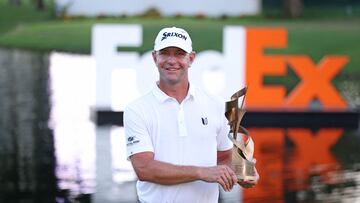 MEMPHIS, TENNESSEE - AUGUST 13: Lucas Glover of the United States poses with the trophy after putting in to win during the first playoff hole on the 18th green to win the tournament during the final round of the FedEx St. Jude Championship at TPC Southwind on August 13, 2023 in Memphis, Tennessee.   Gregory Shamus/Getty Images/AFP (Photo by Gregory Shamus / GETTY IMAGES NORTH AMERICA / Getty Images via AFP)