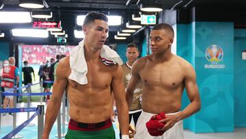 BUDAPEST, HUNGARY - JUNE 23: Cristiano Ronaldo of Portugal speaks with Kylian Mbappe of France in the tunnel following the UEFA Euro 2020 Championship Group F match between Portugal and France at Puskas Arena on June 23, 2021 in Budapest, Hungary. (Photo by Angel Martinez - UEFA/UEFA via Getty Images)