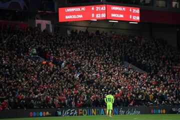 Messi looks dejected as the scoreboard reads '4-0' during Barcelona's Champions League elimination by Liverpool on Tuesday.