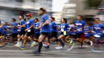 Runners participate in the J-1000 Paris 2024 – Marathon Pour Tous (Marathon For All) to win entry at the Paris Olympics 2024's Mass Marathon on Champs Elysees in Paris, France, October 31, 2021.