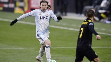 COLUMBUS, OHIO - DECEMBER 06: Thomas McNamara #26 of New England Revolution controls the ball against Pedro Santos #7 of Columbus Crew in the second half during the Eastern Conference Final of the MLS Cup Playoffs at MAPFRE Stadium on December 06, 2020 in