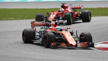 Formula One F1 - Malaysia Grand Prix 2017 - Sepang, Malaysia - October 1, 2017. McLaren&acirc;s Fernando Alonso in action ahead of Ferrari&acirc;s Sebastian Vettel. REUTERS/Edgar Su