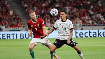 BUDAPEST, HUNGARY - JUNE 11: Jamal Musiala of Germany is challenged by Adam Lang of Hungary during the UEFA Nations League League A Group 3 match between Hungary and Germany at Puskas Arena on June 11, 2022 in Budapest, Hungary. (Photo by Laszlo Szirtesi/Getty Images)
