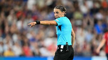 French referee Stephanie Frappart gestures during the UEFA Women's Euro 2025 quarter-final football match between Norway and Italy at the Stade de Geneve in Geneva, on July 16, 2025. (Photo by Fabrice COFFRINI / AFP)