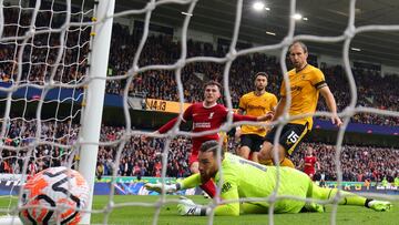 Liverpool's Scottish defender #26 Andrew Robertson (C) scores their second goal during the English Premier League football match between Wolverhampton Wanderers and Liverpool at the Molineux stadium in Wolverhampton, central England on September 16, 2023. (Photo by Adrian DENNIS / AFP) / RESTRICTED TO EDITORIAL USE. No use with unauthorized audio, video, data, fixture lists, club/league logos or 'live' services. Online in-match use limited to 120 images. An additional 40 images may be used in extra time. No video emulation. Social media in-match use limited to 120 images. An additional 40 images may be used in extra time. No use in betting publications, games or single club/league/player publications. /