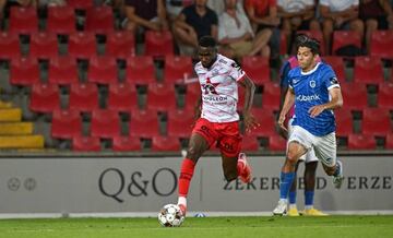 Essevee's Alieu Fadera and Genk's Gerardo Arteaga pictured in action during a soccer match between SV Zulte-Waregem and KRC Genk, Sunday 14 August 2022 in Waregem, on day 4 of the 2022-2023 'Jupiler Pro League' first division of the Belgian championship. BELGA PHOTO DAVID CATRY (Photo by DAVID CATRY / BELGA MAG / Belga via AFP) (Photo by DAVID CATRY/BELGA MAG/AFP via Getty Images)