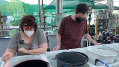 Senior research scientist at Smithsonian National Zoo And Conservation Biology Institute, Mary Hagedorn and Taronga Conservation Society scientist Jonathon Daly observe coral before it is expected to spawn, at the Australian Institute Of Marine Science in Townsville, Australia December 12, 2022. REUTERS/Jill Gralow