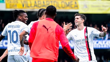 AC Milan's American forward #11 Christian Pulisic (R) celebrates with teammates after scoring his team second goal  during the Italian Serie A football match between Hellas Verona and AC Milan, at the Marcantonio Bentegodi stadium, in Verona, on March 17, 2024. (Photo by Piero CRUCIATTI / AFP)