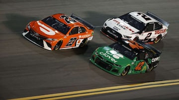 DAYTONA BEACH, FLORIDA - FEBRUARY 11: Bubba Wallace, driver of the #23 DoorDash Toyota, Ross Chastain, driver of the #42 Clover Chevrolet, and Brad Keselowski, driver of the #2 Discount Tire Ford, race during the NASCAR Cup Series Bluegreen Vacations Duel