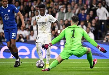 Real Madrid's Vinícius Júnior takes on Chelsea's Spanish goalkeeper Kepa Arrizabalaga during the UEFA Champions League quarter-final first-leg match between Real Madrid and Chelsea at the Santiago Bernabéu.