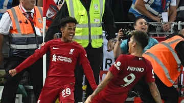 Liverpool's Portuguese midfielder Fabio Carvalho (L) celebrates with Liverpool's Brazilian striker Roberto Firmino (R) after scoring their late second goal during the English Premier League football match between Liverpool and Newcastle United at Anfield in Liverpool, north west England on August 31, 2022. - Liverpool won the game 2-1. - RESTRICTED TO EDITORIAL USE. No use with unauthorized audio, video, data, fixture lists, club/league logos or 'live' services. Online in-match use limited to 120 images. An additional 40 images may be used in extra time. No video emulation. Social media in-match use limited to 120 images. An additional 40 images may be used in extra time. No use in betting publications, games or single club/league/player publications. (Photo by Paul ELLIS / AFP) / RESTRICTED TO EDITORIAL USE. No use with unauthorized audio, video, data, fixture lists, club/league logos or 'live' services. Online in-match use limited to 120 images. An additional 40 images may be used in extra time. No video emulation. Social media in-match use limited to 120 images. An additional 40 images may be used in extra time. No use in betting publications, games or single club/league/player publications. / RESTRICTED TO EDITORIAL USE. No use with unauthorized audio, video, data, fixture lists, club/league logos or 'live' services. Online in-match use limited to 120 images. An additional 40 images may be used in extra time. No video emulation. Social media in-match use limited to 120 images. An additional 40 images may be used in extra time. No use in betting publications, games or single club/league/player publications. (Photo by PAUL ELLIS/AFP via Getty Images)