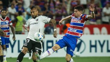 Colo-Colo's midfielder #23 Arturo Vidal and Fortaleza's midfielder #20 Matheus Rossetto fight for the ball during the Copa Libertadores group stage first round football match between Brazil's Fortaleza and Chile's Colo Colo at the Arena Castelao stadium in Fortaleza, Brazil, on May 6, 2025. (Photo by Thiago GADELHA / AFP)