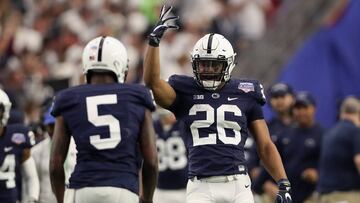 GLENDALE, AZ - DECEMBER 30: Running back Saquon Barkley #26 of the Penn State Nittany Lions celebrates with after scoring on a 92 yard touchdown rush against the Washington Huskies during the first half of the Playstation Fiesta Bowl at University of Phoe