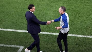 Uruguay's coach Diego Alonso (L) shakes hands with South Korea's Portuguese coach Paulo Bento (R) after the Qatar 2022 World Cup Group H football match between Uruguay and South Korea at the Education City Stadium in Al-Rayyan, west of Doha on November 24, 2022. (Photo by ADRIAN DENNIS / AFP) (Photo by ADRIAN DENNIS/AFP via Getty Images)