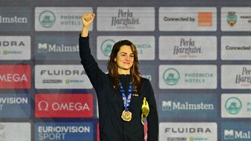 Gold medalist Beryl Gastaldello of France celebrates on the podium after winning the women's 50m Backstroke final of the European Short Course Swimming Championships in Otopeni, Bucharest, on December 8, 2023. (Photo by Daniel MIHAILESCU / AFP)