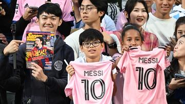 Fans cheer for Inter Miami's Argentine forward Lionel Messi during training for the friendly football match between Hong Kong Team and US Inter Miami CF at the Hong Kong Stadium in Hong Kong on February 3, 2024. (Photo by Peter PARKS / AFP)