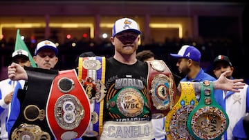 Boxing - Saul 'Canelo' Alvarez vs William Scull - Undisputed Super Middleweight Championship - ANB Arena, Riyadh, Saudi Arabia - May 3, 2025 Saul 'Canelo' Alvarez poses with his championship belts and celebrates after winning his super middleweight fight against William Scull REUTERS/Hamad I Mohammed
