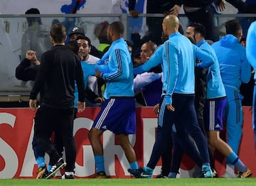 Marseille's Patrice Evra was red carded before kick-off of Thursday's Europa League match at Vitoria Guimaraes after kicking a fan of his own club in the head.