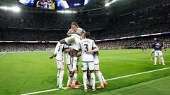 TOPSHOT - Real Madrid players celebrate their third goal scored by Real Madrid's English midfielder #5 Jude Bellingham during the Spanish league football match between Real Madrid CF and FC Barcelona at the Santiago Bernabeu stadium in Madrid on April 21, 2024. (Photo by OSCAR DEL POZO / AFP)