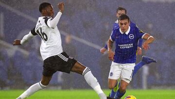 Brighton's Belgian midfielder Leandro Trossard (R) vies with Fulham's English defender Tosin Adarabioyo (L) during the English Premier League football match between Brighton and Hove Albion and Fulham at the American Express Community Stadium in