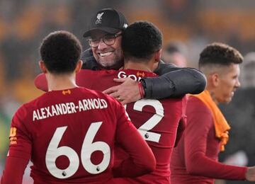 Liverpool's Joe Gomez and manager Juergen Klopp celebrate