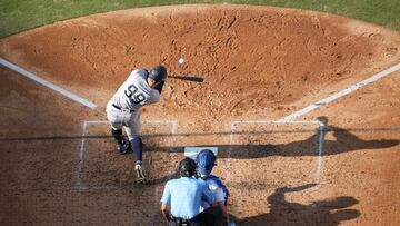 Jun 3, 2023; Los Angeles, California, USA; New York Yankees right fielder Aaron Judge (99) follows through on a home run in the sixth inning as Los Angeles Dodgers catcher Will Smith (16) and home plate umpire John Tumpane (74) watch at Dodger Stadium. Mandatory Credit: Kirby Lee-USA TODAY Sports