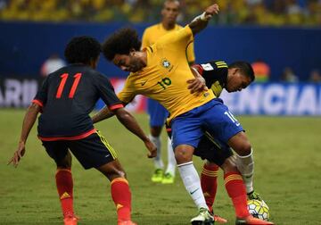 Marcelo getting a good man-handling from Colombia's Carlos Bacca.