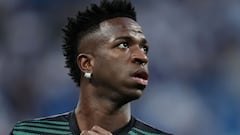 Real Madrid's Brazilian forward Vinicius Junior warms up prior the UEFA Champions League semi-final first leg football match between Real Madrid CF and Manchester City at the Santiago Bernabeu stadium in Madrid on May 9, 2023. Spanish prosecutors opened a probe on May 22, 2023 into racist chants aimed at Real Madrid's star forward Vinicius Junior during a match as the football federation president admitted the country had a "problem" with racism. (Photo by Thomas COEX / AFP)