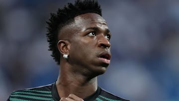 Real Madrid's Brazilian forward Vinicius Junior warms up prior the UEFA Champions League semi-final first leg football match between Real Madrid CF and Manchester City at the Santiago Bernabeu stadium in Madrid on May 9, 2023. Spanish prosecutors opened a probe on May 22, 2023 into racist chants aimed at Real Madrid's star forward Vinicius Junior during a match as the football federation president admitted the country had a "problem" with racism. (Photo by Thomas COEX / AFP)