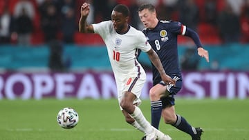 Soccer Football - Euro 2020 - Group D - England v Scotland - Wembley Stadium, London, Britain - June 18, 2021 England&#039;s Raheem Sterling in action with Scotland&#039;s Callum McGregor Pool via REUTERS/Carl Recine