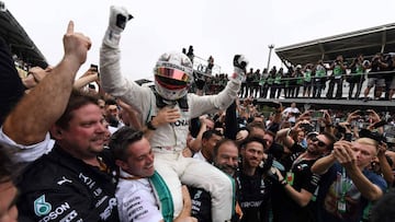 (FILES) In this file photo taken on November 11, 2018 Mercedes&#039; British driver Lewis Hamilton celebrates after winning the F1 Brazil Grand Prix, while Mercedes took the constructors title, at the Interlagos racetrack in Sao Paulo, Brazil. (Photo by EVARISTO SA / AFP)
