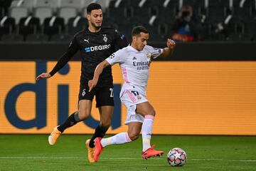 Ramy Bensebaini y Lucas Vázquez.