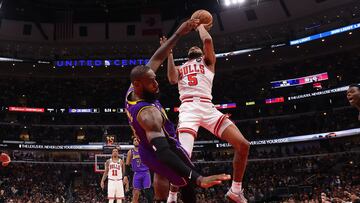 CHICAGO, ILLINOIS - MARCH 29: LeBron James #6 of the Los Angeles Lakers draws a charge from Derrick Jones Jr. #5 of the Chicago Bulls during the second half at United Center on March 29, 2023 in Chicago, Illinois. NOTE TO USER: User expressly acknowledges and agrees that, by downloading and or using this photograph, User is consenting to the terms and conditions of the Getty Images License Agreement.   Michael Reaves/Getty Images/AFP (Photo by Michael Reaves / GETTY IMAGES NORTH AMERICA / Getty Images via AFP)