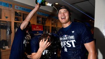 LOS ANGELES, CALIFORNIA - SEPTEMBER 26: Shohei Ohtani #17 and Yoshinobu Yamamoto #18 of the Los Angeles Dodgers celebrate after winning the NL West Division against the San Diego Padres at Dodger Stadium on September 26, 2024 in Los Angeles, California. Kevork Djansezian/Getty Images/AFP (Photo by KEVORK DJANSEZIAN / GETTY IMAGES NORTH AMERICA / Getty Images via AFP)