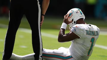 MIAMI GARDENS, FLORIDA - SEPTEMBER 25: Quarterback Tua Tagovailoa #1 of the Miami Dolphins sits on the turf during the first half of the game against the Buffalo Bills at Hard Rock Stadium on September 25, 2022 in Miami Gardens, Florida.   Megan Briggs/Getty Images/AFP