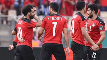 Egypt's forward Mohamed Salah (L) celebrates with teammates after scoring his team's first goal during the Africa Cup of Nations (CAN) 2021 quarter-final football match between Egypt and Morocco at Stade Ahmadou Ahidjo in Yaounde on January 30,
