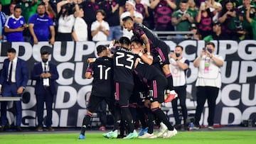 Mexico's players celebrate a goal by Jonathan Dos Santos against Honduras during the Concacaf Gold Cup quarter final footbal match between Mexico and Honduras at State Farm stadium in Glendale, Arizona on July 24, 2021. (Photo by Frederic J. BROWN /