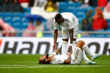 Vinicius tends to Marcelo after he suffered an injury against Levante.