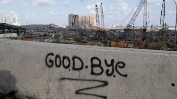 A picture taken on August 9, 2020, shows graffiti on the wall of a bridge overlooking the port of Beirut, the site of the explosion which killed at least 154 people and devastated swathes of the capital. (Photo by ANWAR AMRO / european afp / AFP)