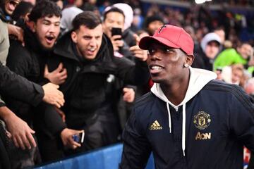 Paul Pogba celebrates with United fans at Parc des Princes