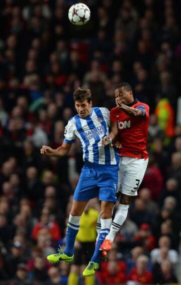 Patrice Evra y Xabi Prieto.