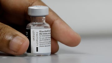 FILE PHOTO: A medical worker prepares to dilute a vial of Pfizer-BioNTech vaccine at a coronavirus disease (COVID-19) vaccination center in Singapore March 8, 2021. REUTERS/Edgar Su/File Photo