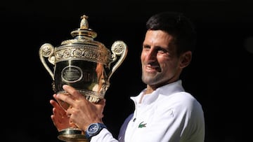 LONDON, ENGLAND - JULY 10: Novak Djokovic (SRB) poses with the trophy as he celebrates victory over Nick Kyrgios (AUS) in their Gentlemen's Singles Final during day fourteen of The Championships Wimbledon 2022 at All England Lawn Tennis and Croquet Club on July 10, 2022 in London, England. (Photo by Simon Stacpoole/Offside/Offside via Getty Images)