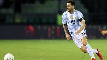 Argentina's Lionel Messi eyes the ball during the South American qualification football match for the FIFA World Cup Qatar 2022 against Venezuela at the UCV Olympic Stadium in Caracas on September 2, 2021. (Photo by Edilzon Gamez / POOL / AFP)