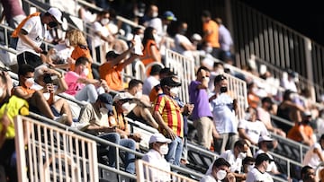 VALENCIA, SPAIN - MAY 16: Fans wear face masks as they wait for kick off prior to the La Liga Santander match between Valencia CF and SD Eibar at Estadio Mestalla on May 16, 2021 in Valencia, Spain. Valencia CF will host 5,000 fans in the stadium for the