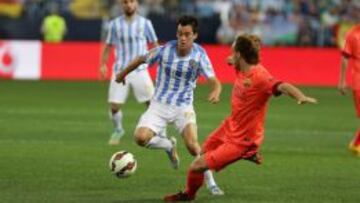 Juanpi, ante Rakitic.