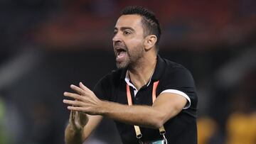Sadd's coach Xavi reacts during the 2019 FIFA Club World Cup football match between Qatar's Al-Sadd and New Caledonia's Hienghene Sport at the Jassim Bin Hamad Stadium in the Qatari capital Doha on December 11, 2019. (Photo by KARIM JAAFAR