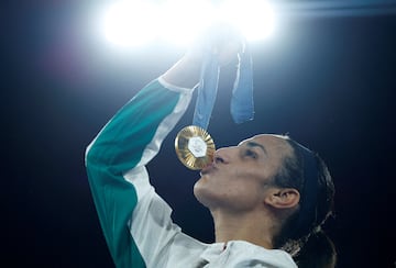 Gold medallist Imane Khelif of Algeria kisses her medal.